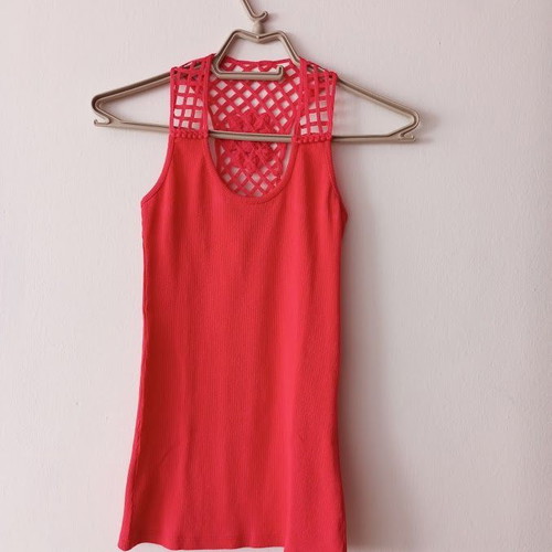 Red sleeveless blouse like new with white shorts and striped belt
