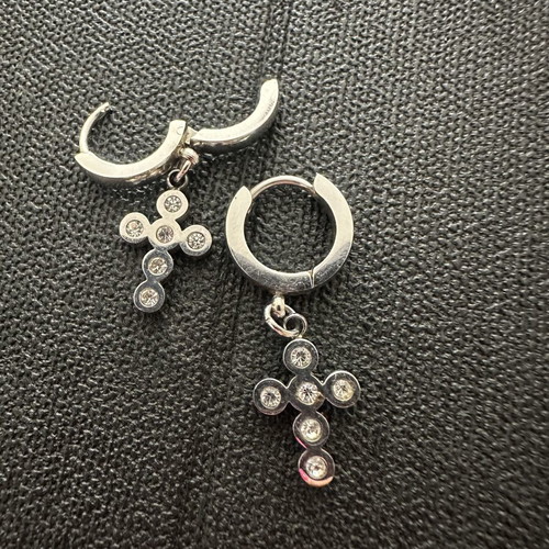 Silver huggie hoop earrings with rhinestone cross pendant