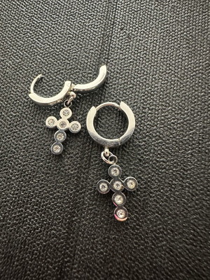 Silver huggie hoop earrings with rhinestone cross pendant
