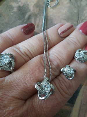 Silver set like new with pendant, stud earrings and adjustable ring with rhinestones