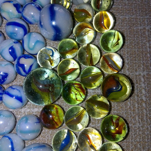 Collection of 68 used glass marbles in various sizes