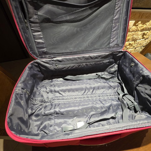 Carpisa 24" travel suitcase used, magenta color, semi-hard fabric