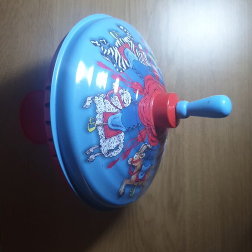 Metal spinning top like new with circus animal design