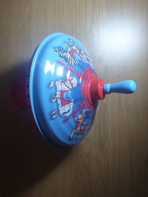 Metal spinning top like new with circus animal design