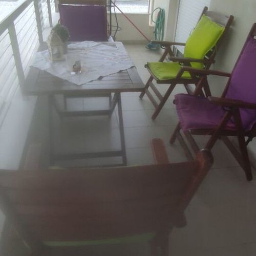 Balcony table with 4 wooden folding chairs used