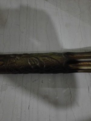 Large carved artillery shell casing used