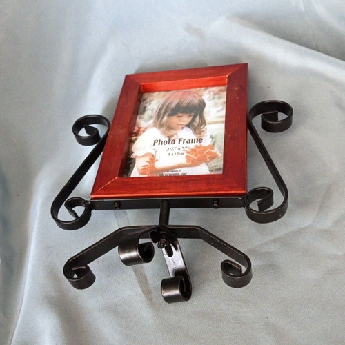 Rotating wooden photo frame with metal decorative base like new