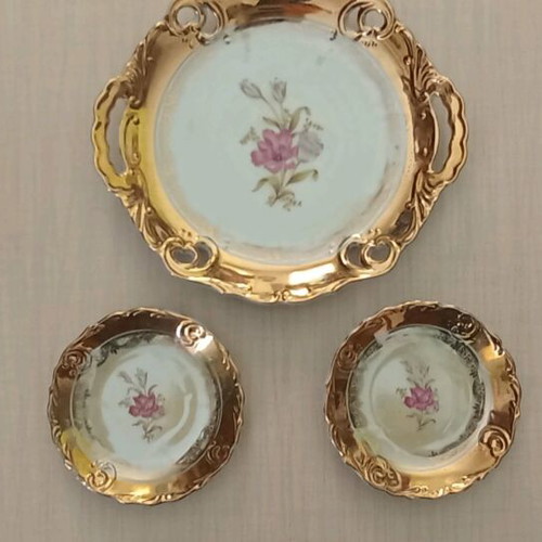 Porcelain platter and two small plates like new with gold decoration