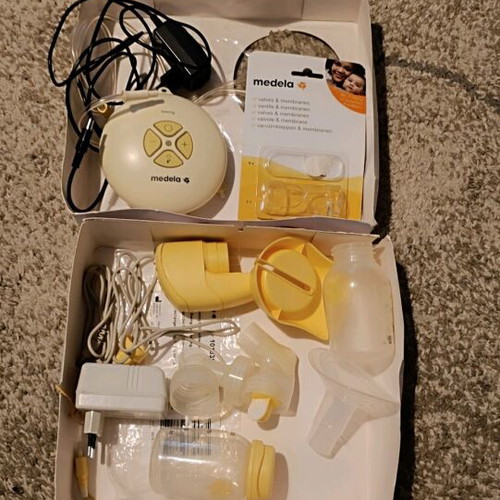 Medela Swing electric breast pump used, complete set with extras