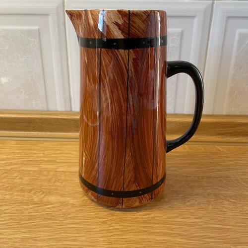 Vintage ceramic pitcher like new with wooden barrel design