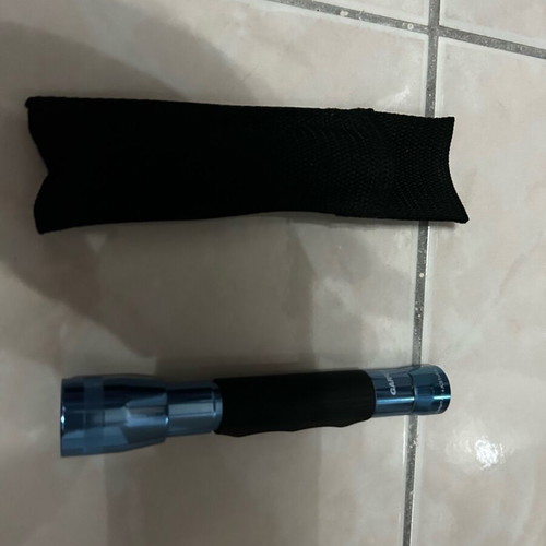 Handheld flashlight like new with belt case