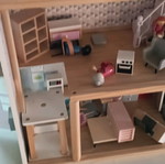 Wooden dollhouse used with extra accessories pack