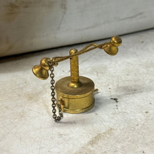 Brass miniature of old candlestick telephone, used