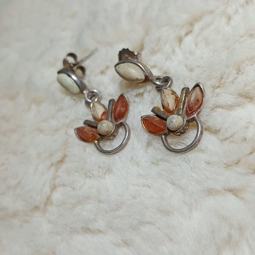 Silver earrings with amber used