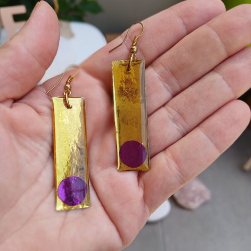 Handmade earrings with purple and gold resin