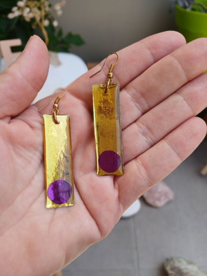 Handmade earrings with purple and gold resin