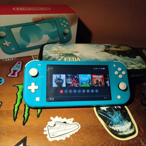 Nintendo Switch Lite Turquoise 32GB bundle with case and SD card used