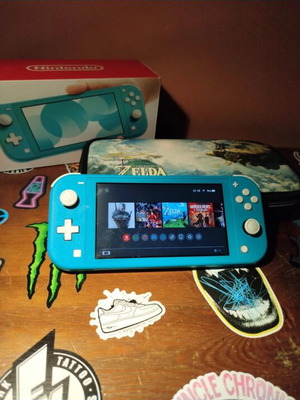 Nintendo Switch Lite Turquoise 32GB bundle with case and SD card used