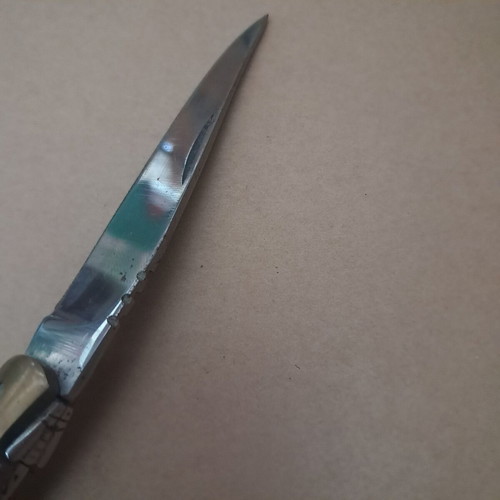 Vintage folding knife like new with multicolored wood handle