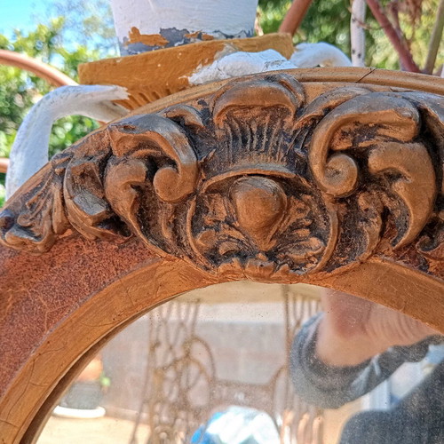 Old carved oval mirror used