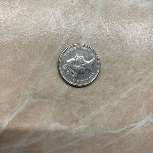 Coins one penny 2010 and five pence 1991 used
