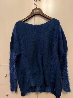 Knitted blue pullover like new with various patterns and textures