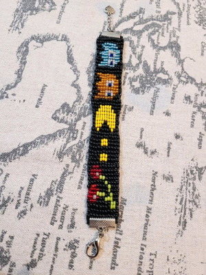 Beaded bracelet like new, handmade, black with colorful Pacman design