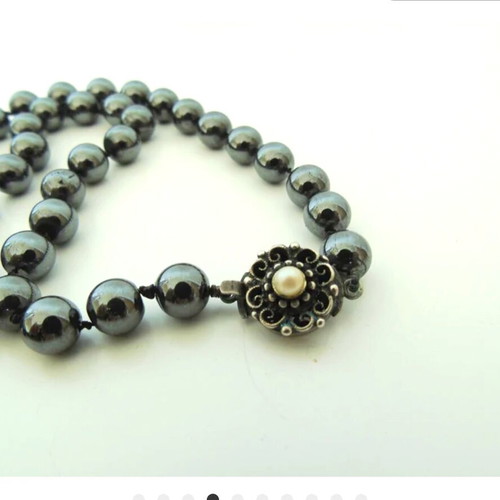 Vintage necklace with hematite beads and motif-pin used, gray
