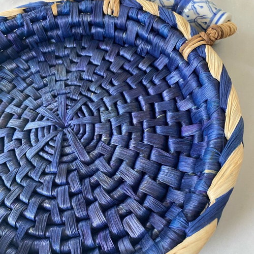 Blue handmade wicker basket with painted porcelain handles like new
