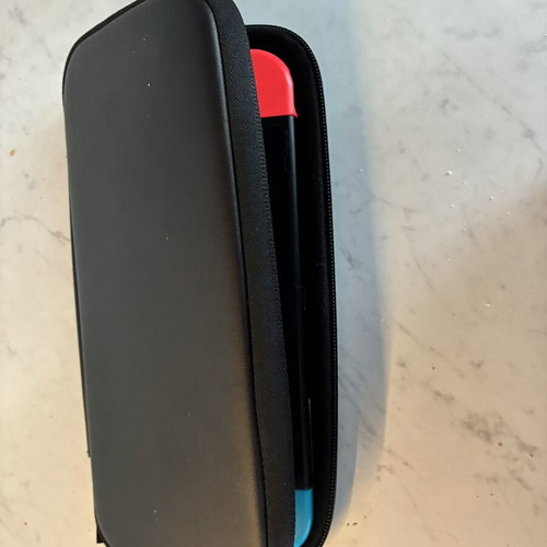 Nintendo Switch V2 console used with 2 games and carrying case