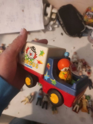 Playmobil clown and car used with permanent marker marks