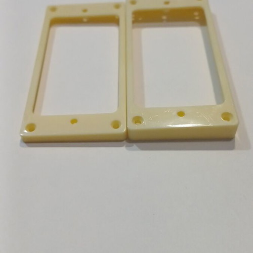 Set of two cream plastic rings for electric guitar humbucker pickups