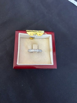 Silver ring band with white stones