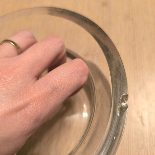 Glass decorative bowl used with silver flower design