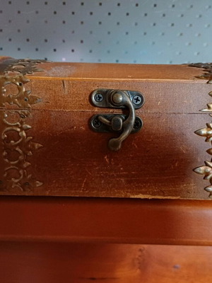 Wooden jewelry chest used with metal details