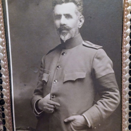 Old military photograph on embroidered frame used