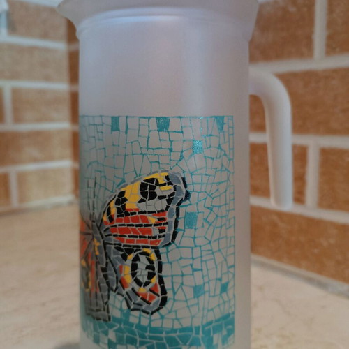 Glass pitcher with butterfly design like new