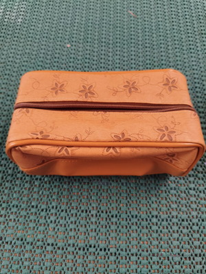 Women's cosmetic bag with floral punch-out design, synthetic leather, camel