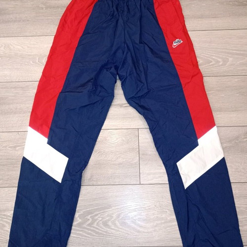 Nike track pants used, navy with red stripes