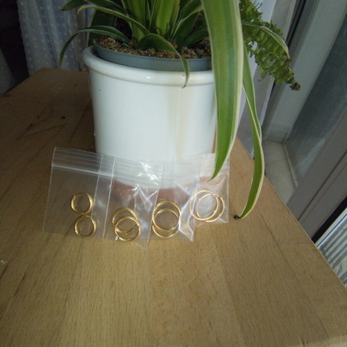 Gold stainless steel hoop earrings, 4 pairs, new in packaging