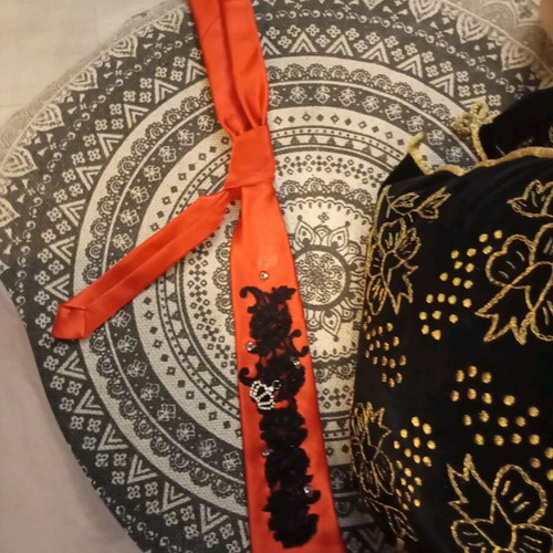 Red tie like new with pearls
