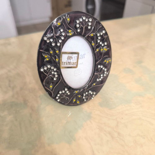 Round photo frame like new with colorful decorative patterns