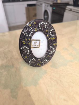 Round photo frame like new with colorful decorative patterns