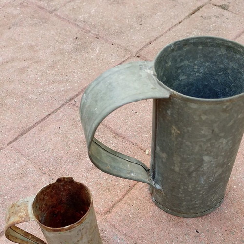 Vintage metal water and oil measuring cups used, set of two
