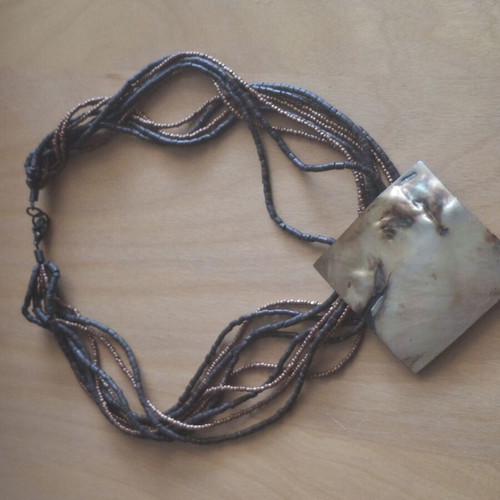 Necklace with large mother-of-pearl plate and beads