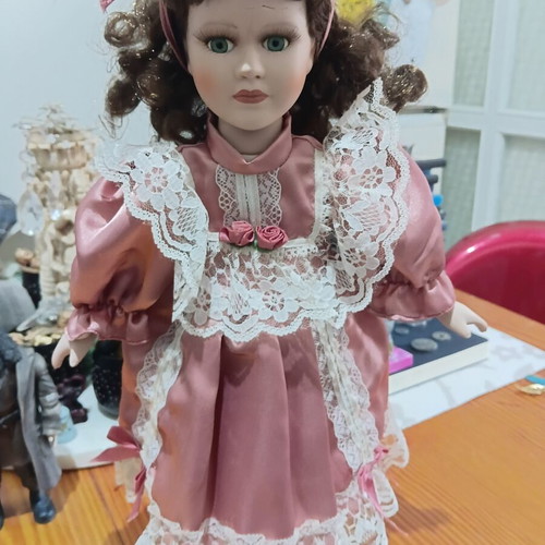 Porcelain doll used with cracked forehead from fall