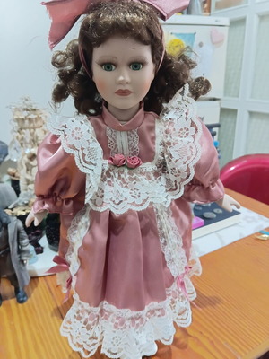 Porcelain doll used with cracked forehead from fall