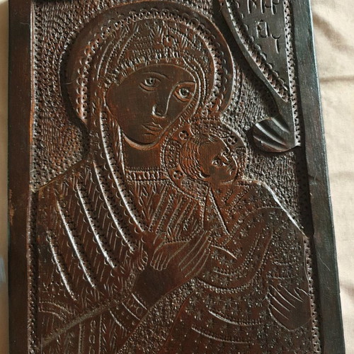 Wooden carved icon of Virgin Mary with baby Jesus