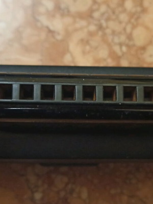 Hohner harmonica used with case