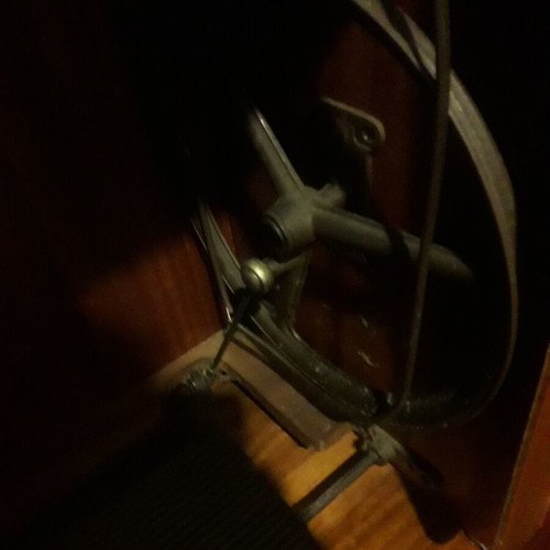Singer sewing machine refurbished, foot-operated with cabinet